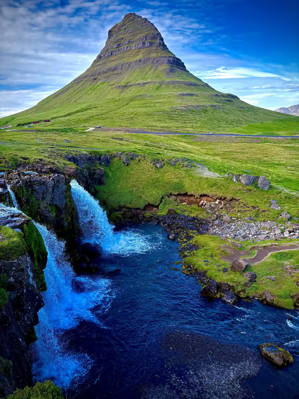 Moss-covered mountain peak with blue stream flowing