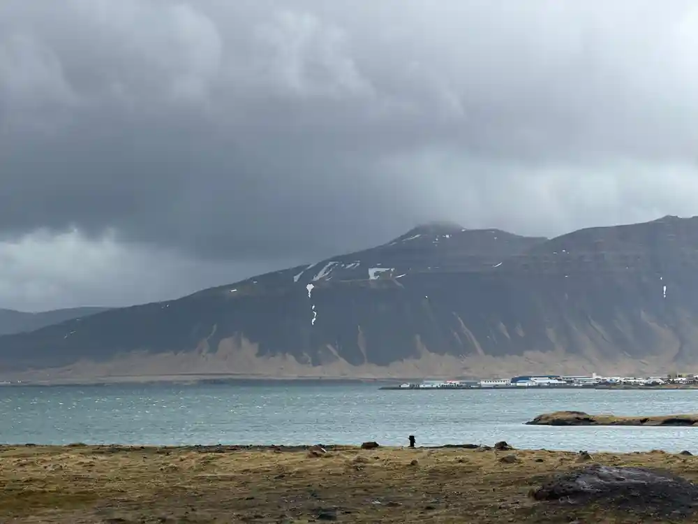 Mountain with bare slopes overlooking turquoise bay