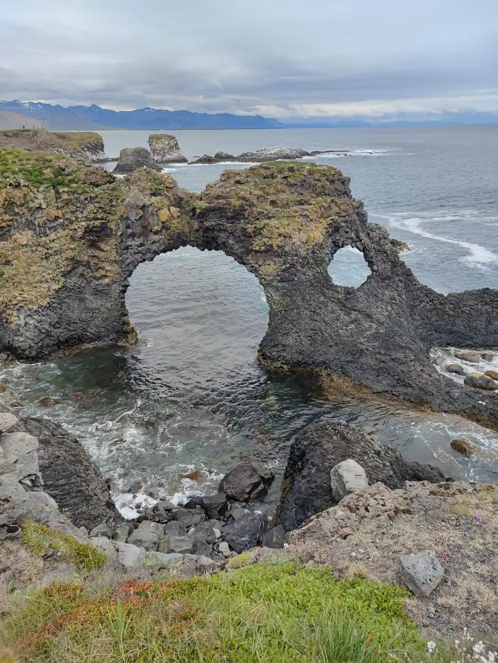 Natural rock arch formation in coastal waters