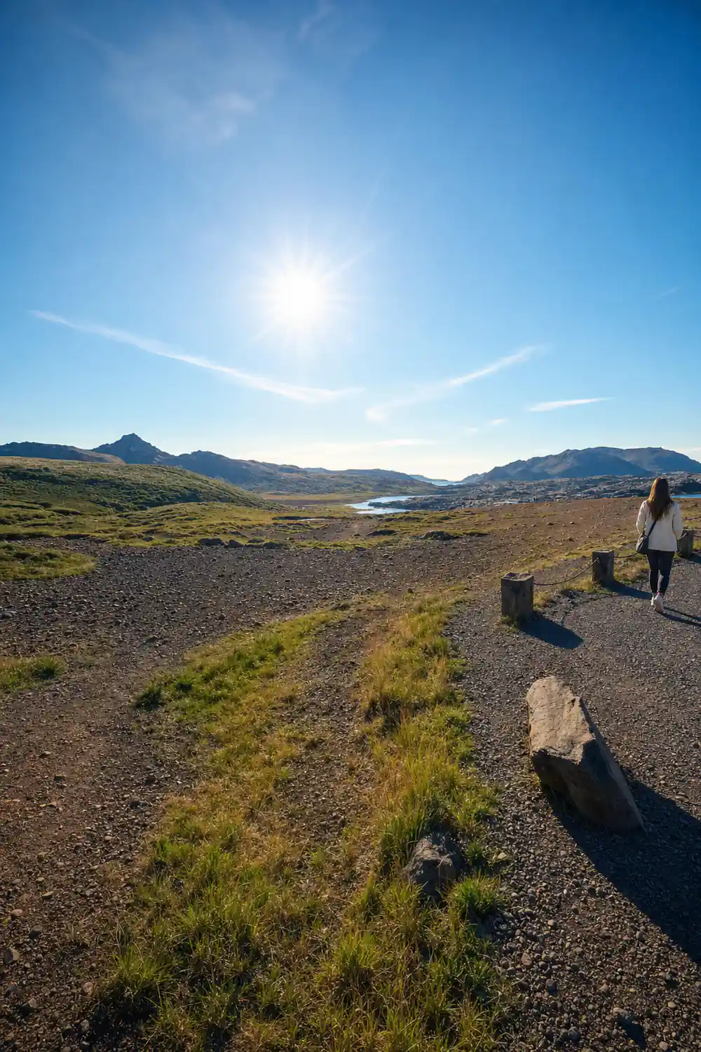 Vast volcanic landscape with distant snow-capped peaks